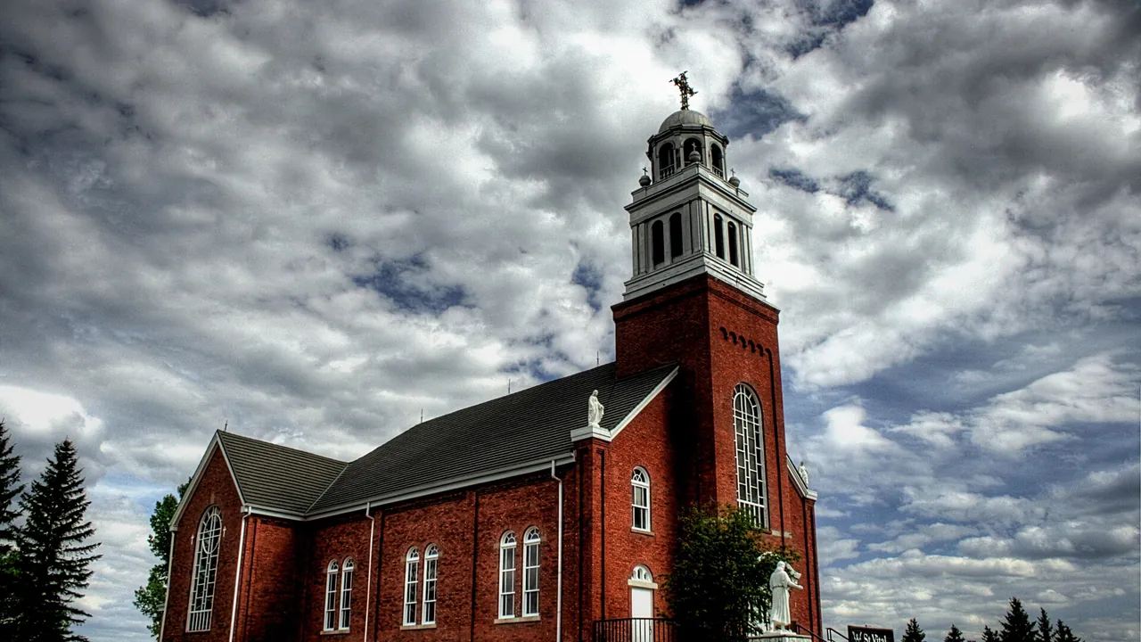 Beaumont church steeple and Four Lakes park in Beaumont, Alberta